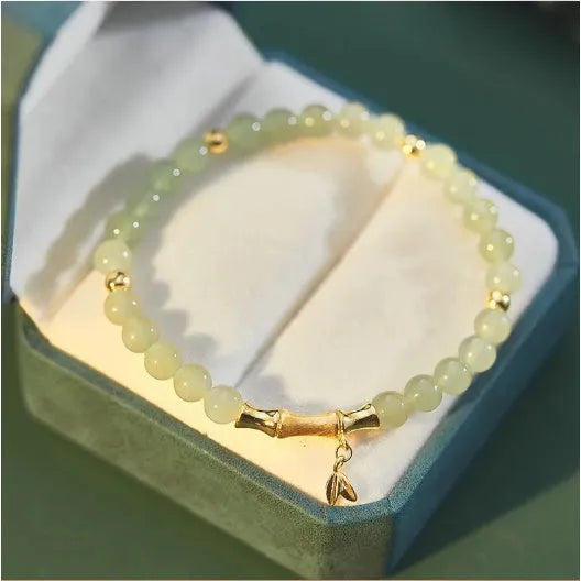 Retro bamboo design bracelet with floral shape and ruyi element in glass and coloured glaze