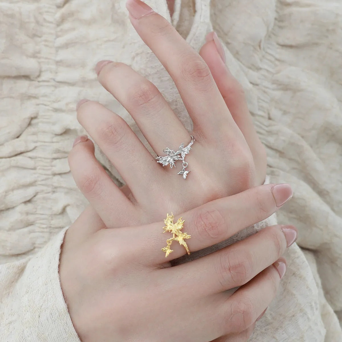 Adjustable open silver ring with a wild butterfly design in a choice of metallic finishes.