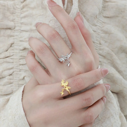 Adjustable open silver ring with a wild butterfly design in a choice of metallic finishes.