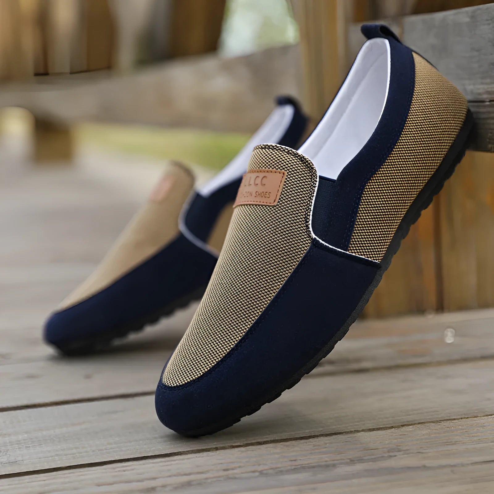 Men's grey canvas lace-up casual shoes with a round toe and rubber sole.
