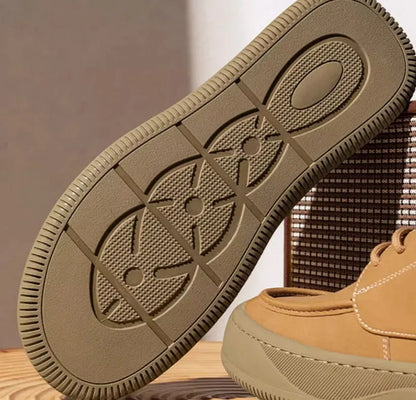 Retro brown leather lace-up casual shoes for men with visible stitching and a rubber sole.