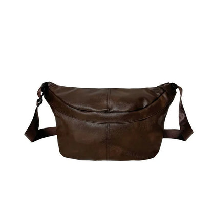 Men's brown vintage PU leather crossbody bag showing large main compartment and slim profile