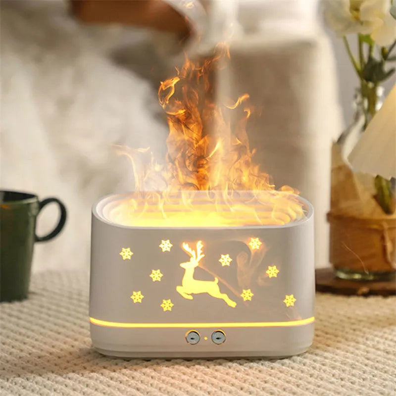 White round Elk flame effect humidifier and essential oil diffuser on a surface with mist and light on.