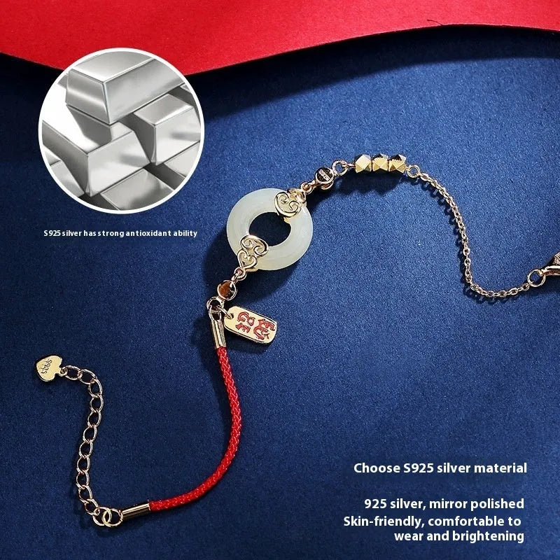 Chinese style sterling silver and Hetian jade jewellery set with bracelet, necklace, and earrings.