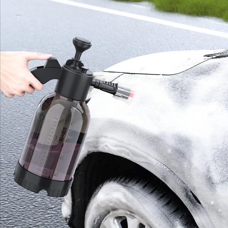 Black 2-litre hand-held foam sprayer and watering can with ergonomic handle and trigger lock.