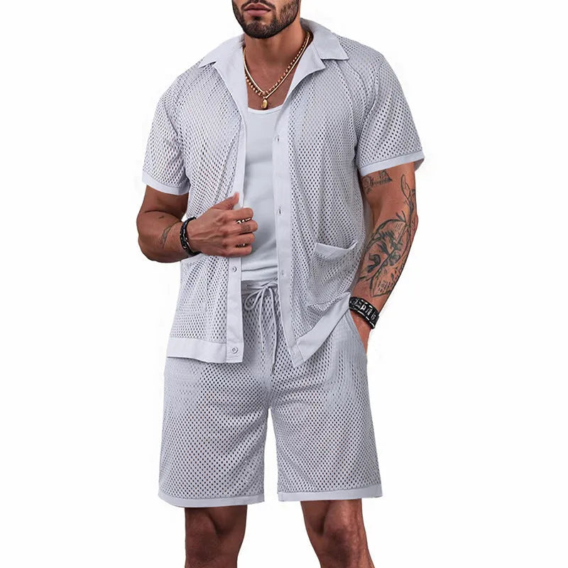 Light blue see-through beach shorts suit with matching cardigan on a summer background.