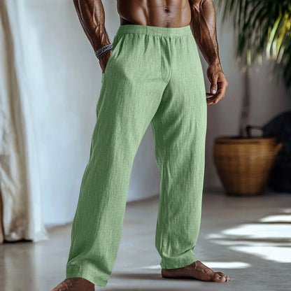 Straight leg cotton linen trousers in light green, shown with side pockets and a casual fit.