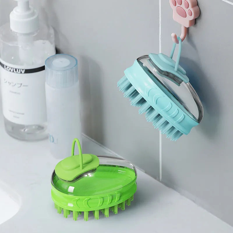 Blue and green pet bath brushes with soft TPR bristles and plastic handles for dog grooming