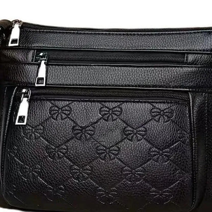 Butterfly black women's crossbody bag with horizontal square shape, slit pocket, and embossed PU detail