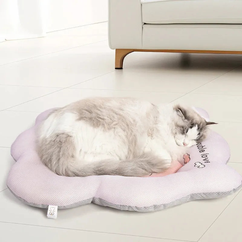 Ice silk pet cooling mat in green and pink colours showing four size options for dogs and cats