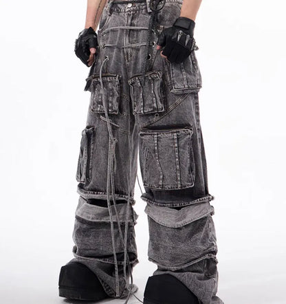 Grey distressed denim overalls jumpsuit with rope stitching on a hanger.
