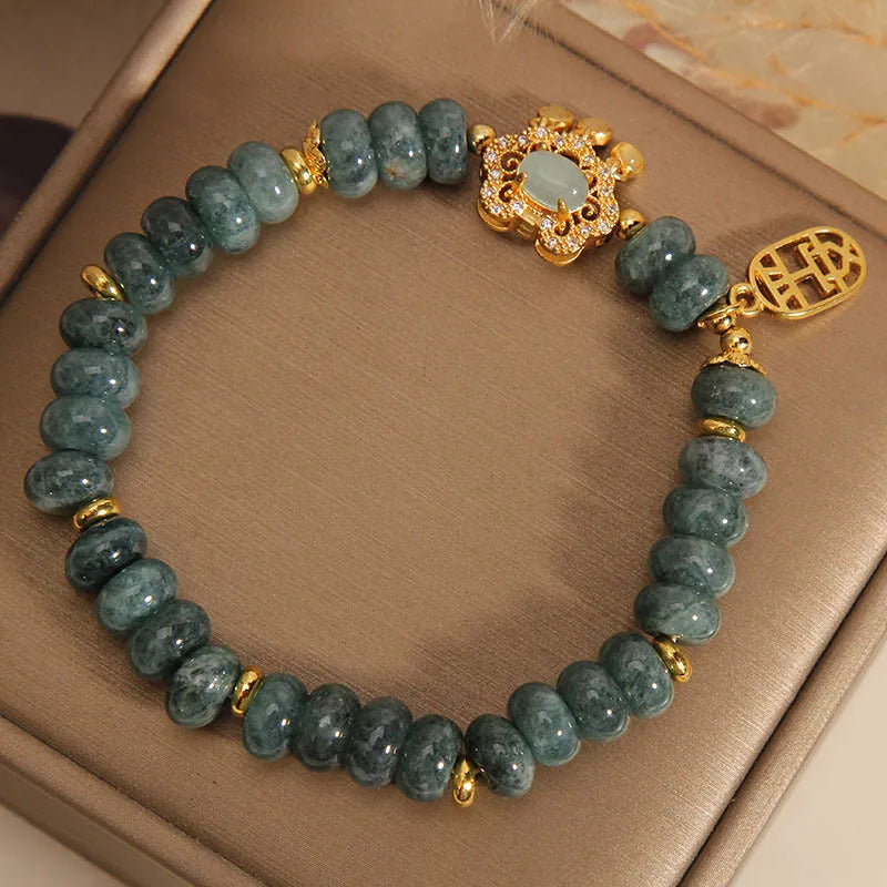 Women's natural emerald jade bracelet with abacus bead design and safety lock clasp