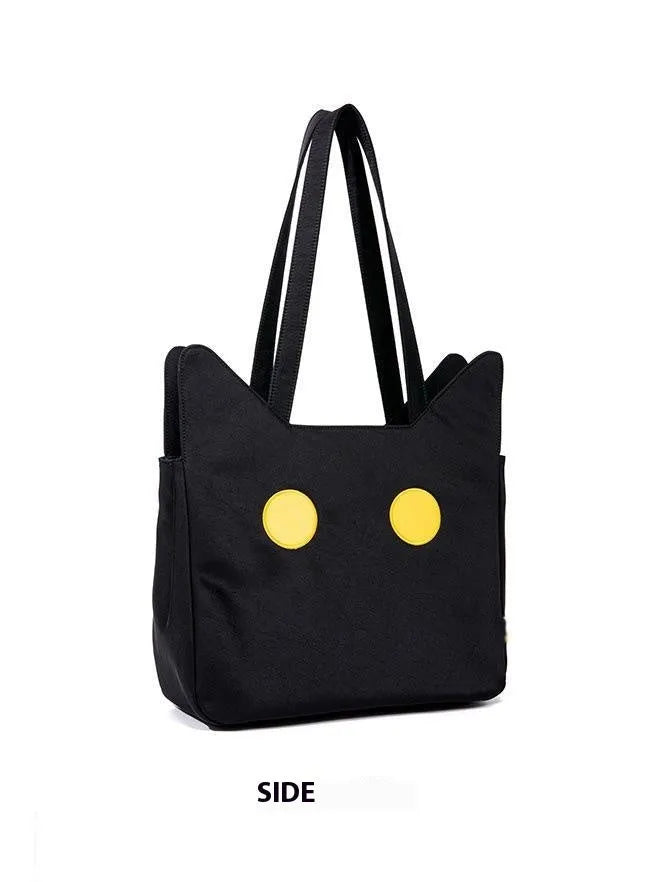 Black cat-shaped nylon tote bag with medium-soft structure, nylon lining, and sandwich zipper pocket, 34cm x 13cm x 27cm.
