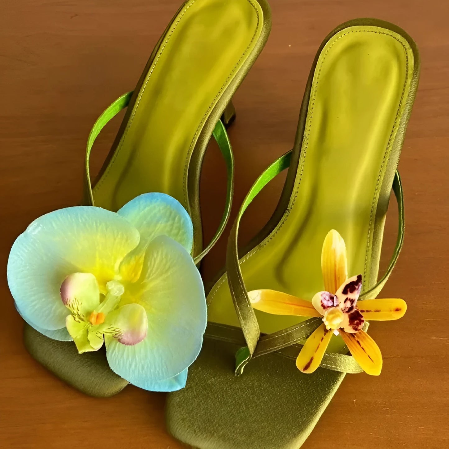 Women's handmade asymmetric flower high heel sandals in black, green, pink, or white on a calf leather upper with EVA sole.
