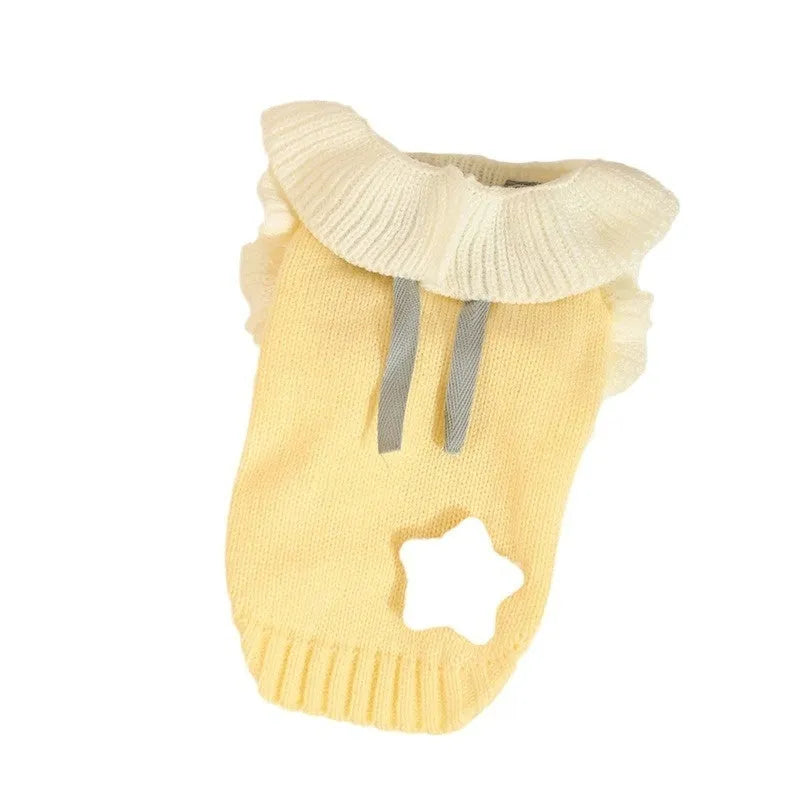Yellow acrylic knit dog sweater on a small dog, showing casual style and fit.