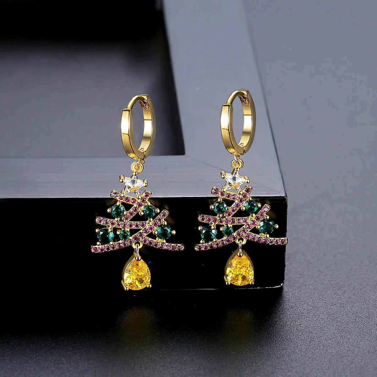 Shimmering gold Christmas tree earrings with colorful rhinestones, a must-have holiday fashion accessory