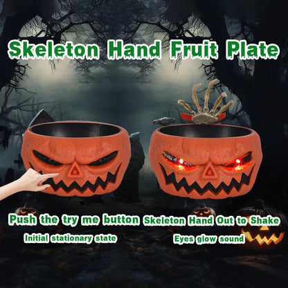 Motion-activated Halloween pumpkin candy bowl with lighted red eyes and skeleton hand in grey colour