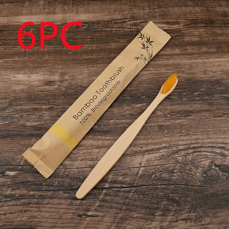 10 natural bamboo toothbrushes with charcoal bristles in six colours showing 17.5cm length