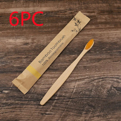 10 natural bamboo toothbrushes with charcoal bristles in six colours showing 17.5cm length