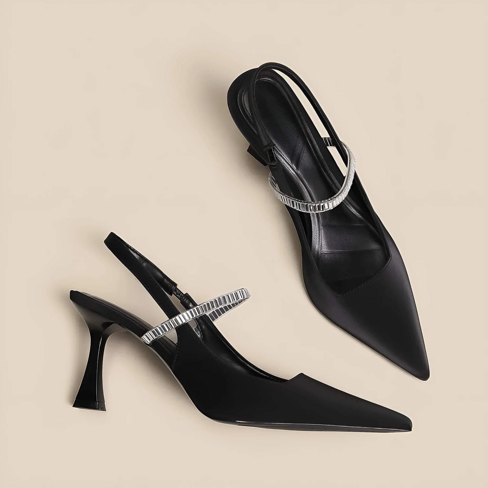 Black women's stiletto sandals with pointed toe and buckle strap closure