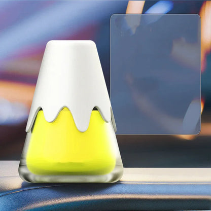Snow Mountain Cup car air freshener, a purple glass vessel with ceramic paste, placed on a car dashboard