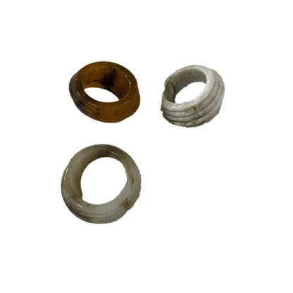 Geometric Chinese-style wide resin ring in brown and white colours on a plain background.