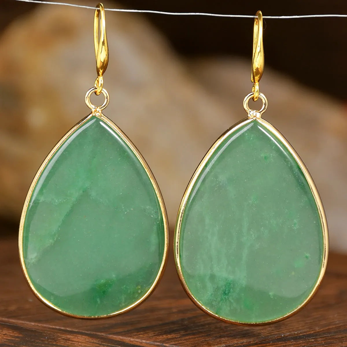 Women's retro-style drop earrings with a natural stone pendant in a water drop shape on an electroplated setting.