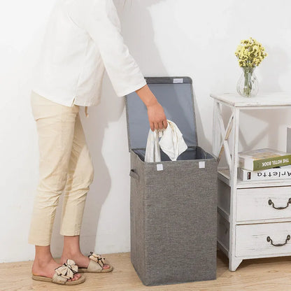 Foldable cube-shaped laundry basket in cotton linen fabric, shown in brown colour.