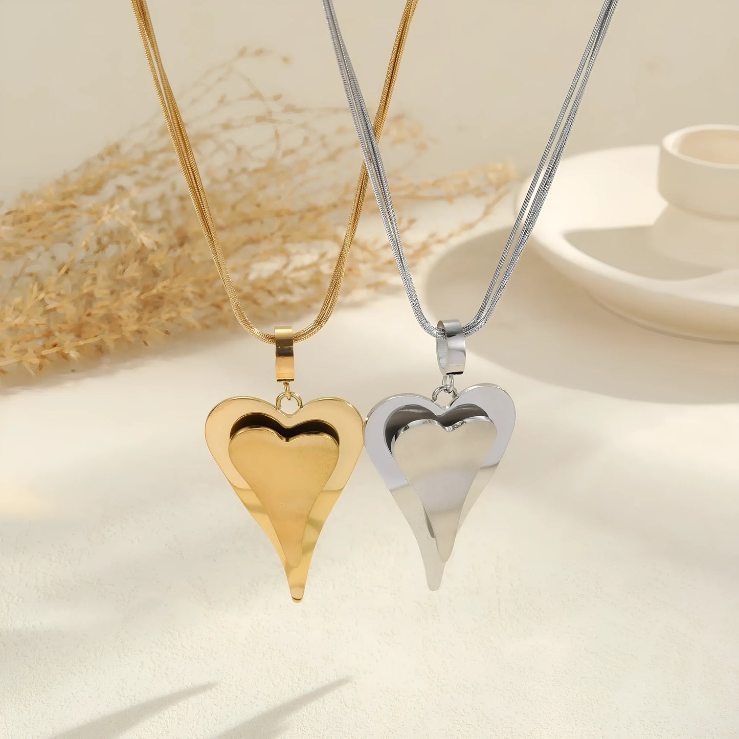 Stainless steel geometric necklace with double heart snake bones pendant in gold or steel colour