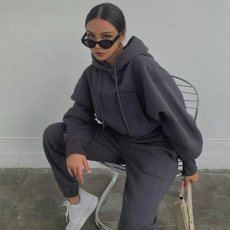 Women's polyester hoodie jacket and sports pants set in various colors for casual and athletic wear