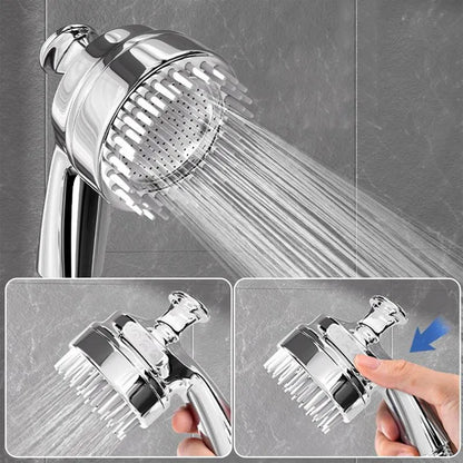 Silver dog shower attachment with integrated silicone comb and rubber grip handles.