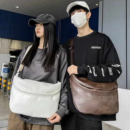 Men's brown vintage PU leather crossbody bag showing large main compartment and slim profile