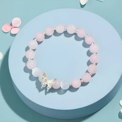 Women's crystal bow bracelet with butterfly design in ocean blue, pink, and purple colour options