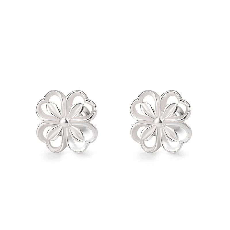 Elegant sterling silver stud earrings with delicate floral accents, suitable for both men and women