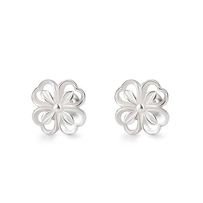Elegant sterling silver stud earrings with delicate floral accents, suitable for both men and women