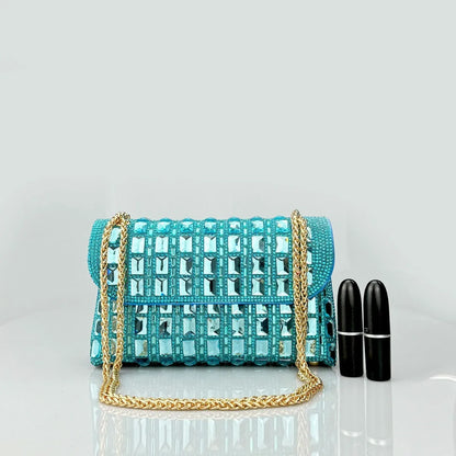 Silver rhinestone-decorated PU leather clutch bag with a metal chain strap, shown open to reveal interior phone pocket.