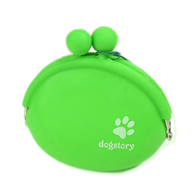 Yellow silicone dog training treat pouch with hook and loop closure, shown on a waistband.