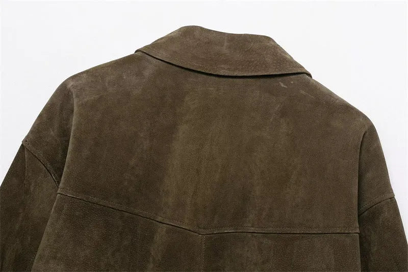 Women's black PU leather-look casual jacket with a relaxed fit, shown on a model.