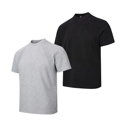 Loose-fit black short sleeve top with textured air layer stitching on a mannequin.