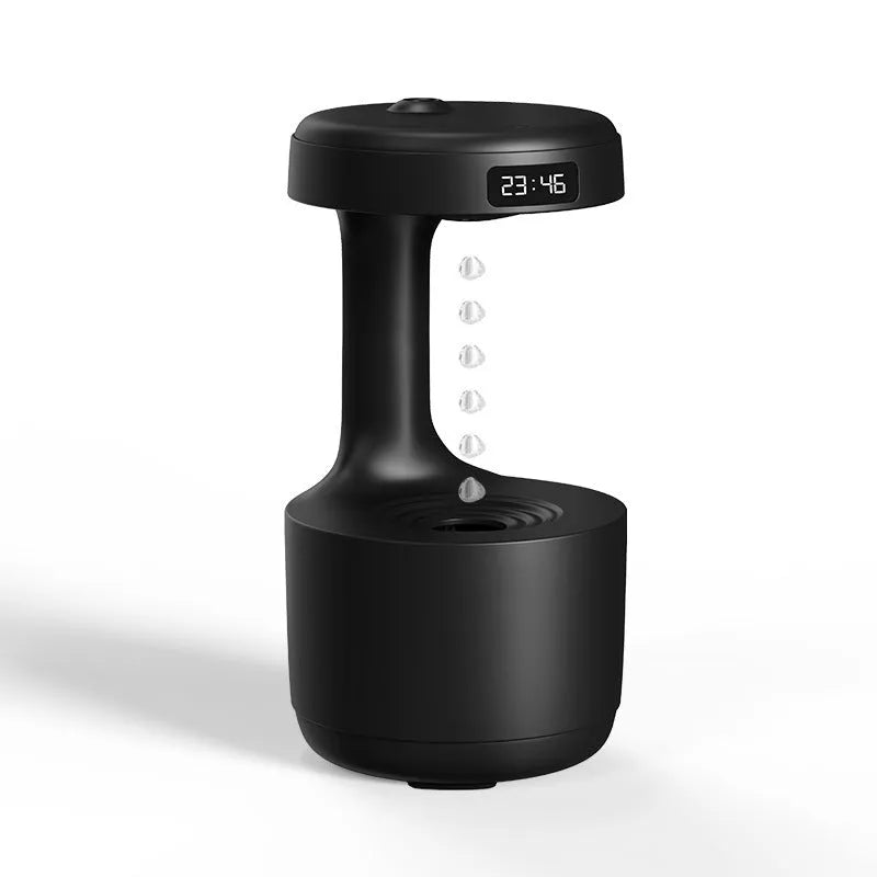 White anti-gravity humidifier showing water droplets appearing to levitate upwards from its base