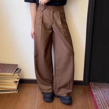 Man wearing straight-leg wide-leg casual trousers in brown, showcasing the relaxed drape and fit.