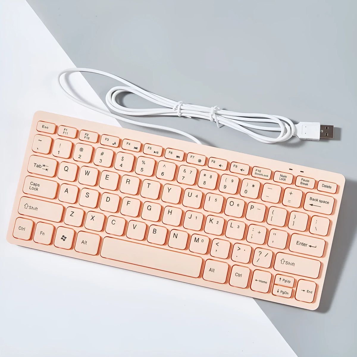 USB wired mini keyboard in four colour options showing compact 280mm design