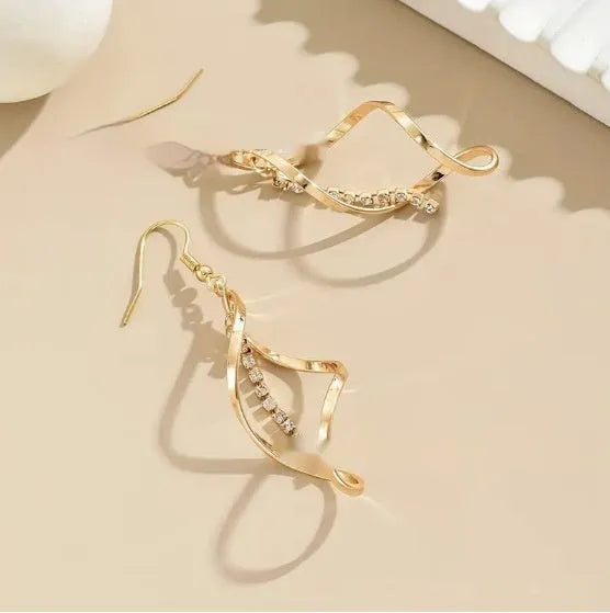Gold electroplated alloy spiral drop earrings with geometric elliptical design for women