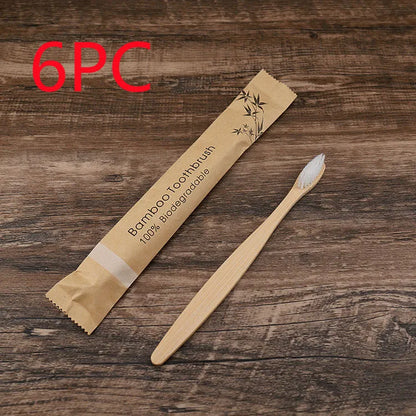 10 natural bamboo toothbrushes with charcoal bristles in six colours showing 17.5cm length