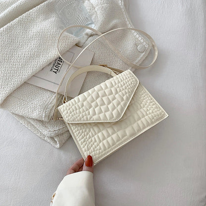 Clamshell handbag with crocodile pattern and soft handle in various colours