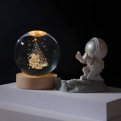 Cosmos Series crystal ball night light with wooden base and astronaut figure, showing Milky Way light pattern