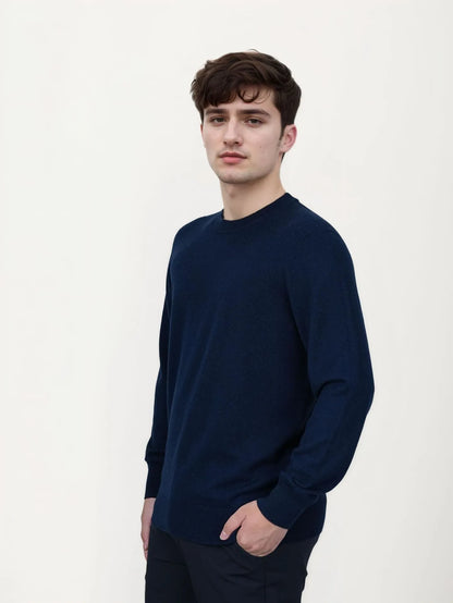Men's V-neck wool pullover sweater in light grey shown on a model.