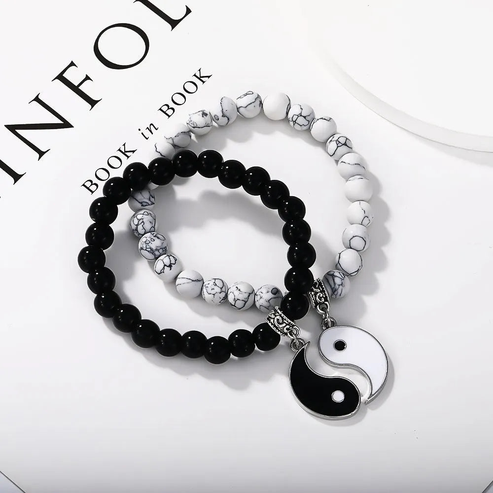 Geometric eight-diagram shaped alloy bracelet with an electroplated finish in a unisex design.