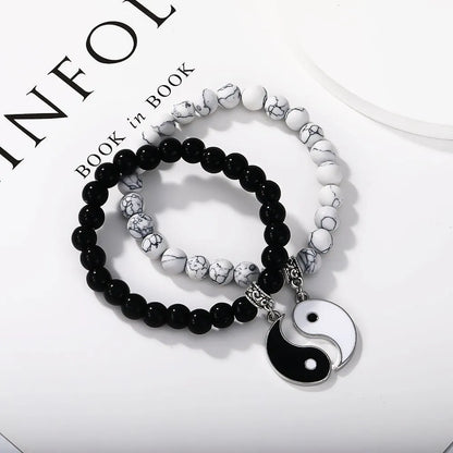 Geometric eight-diagram shaped alloy bracelet with an electroplated finish in a unisex design.