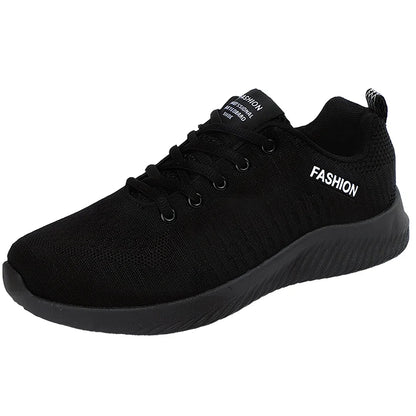 Men's black mesh sports shoes with red accent details and flexible PVC sole construction